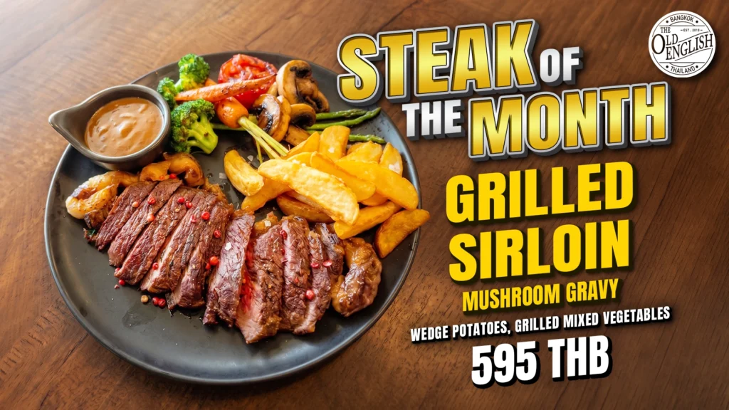 The Old English Bangkok's July Steak of the Month featuring a premium grilled sirloin, wedge potatoes, grilled mixed vegetables, and mushroom gravy for 595 THB